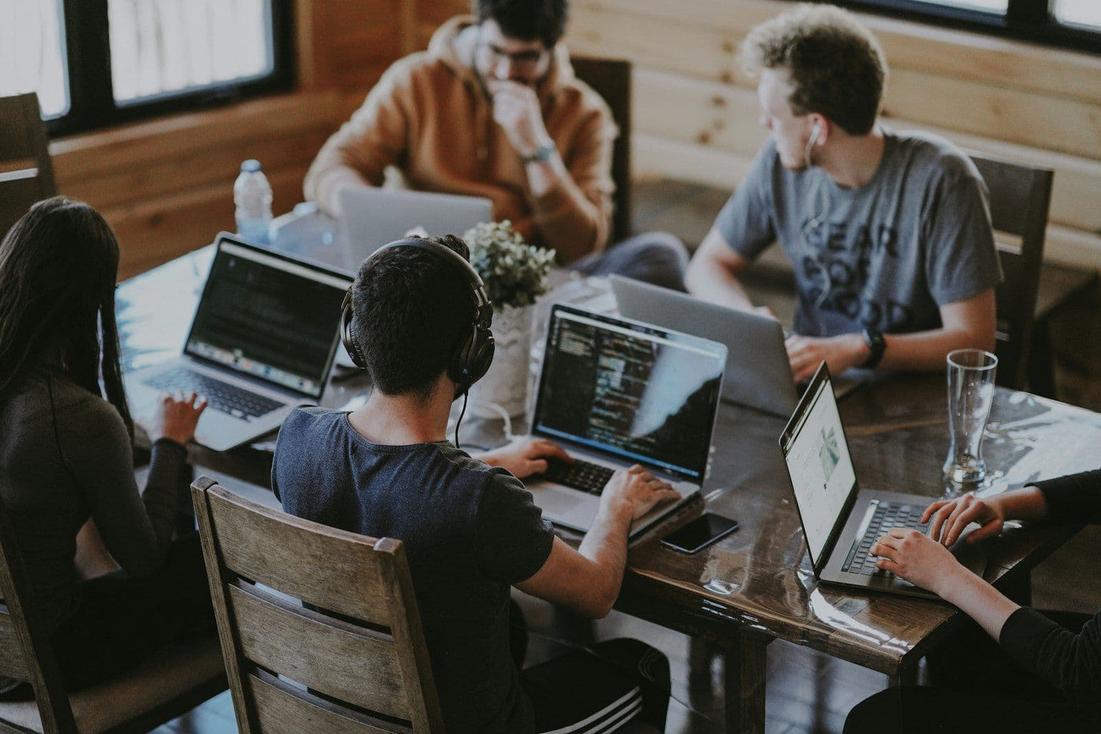 Bright coworking space with long wooden desks